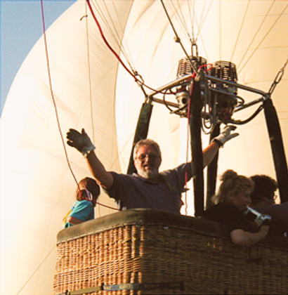 Derald Young waving from his hot air balloon basket