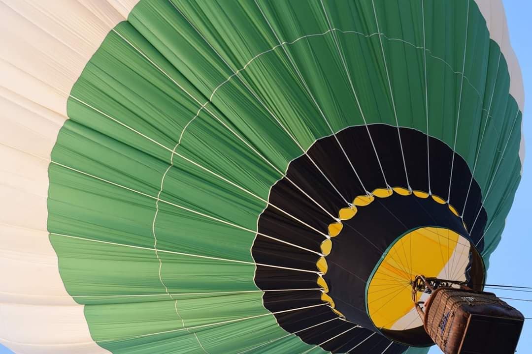 Close-up of a colorful hot air balloon envelope inflating